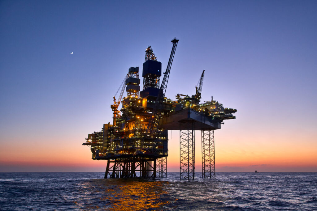 Offshore oil and gas platform on production site. Jack up rig crude oil production in the North Sea - em360