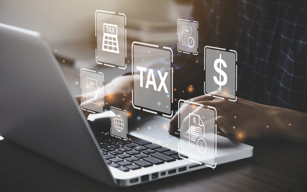 Busines using a computer to complete Individual income tax return form online for tax payment. Government, state taxes. Data analysis, paperwork, financial research, report. Calculation tax return - em360